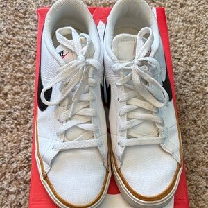 Nike White Sneakers with Black and Gold Accents